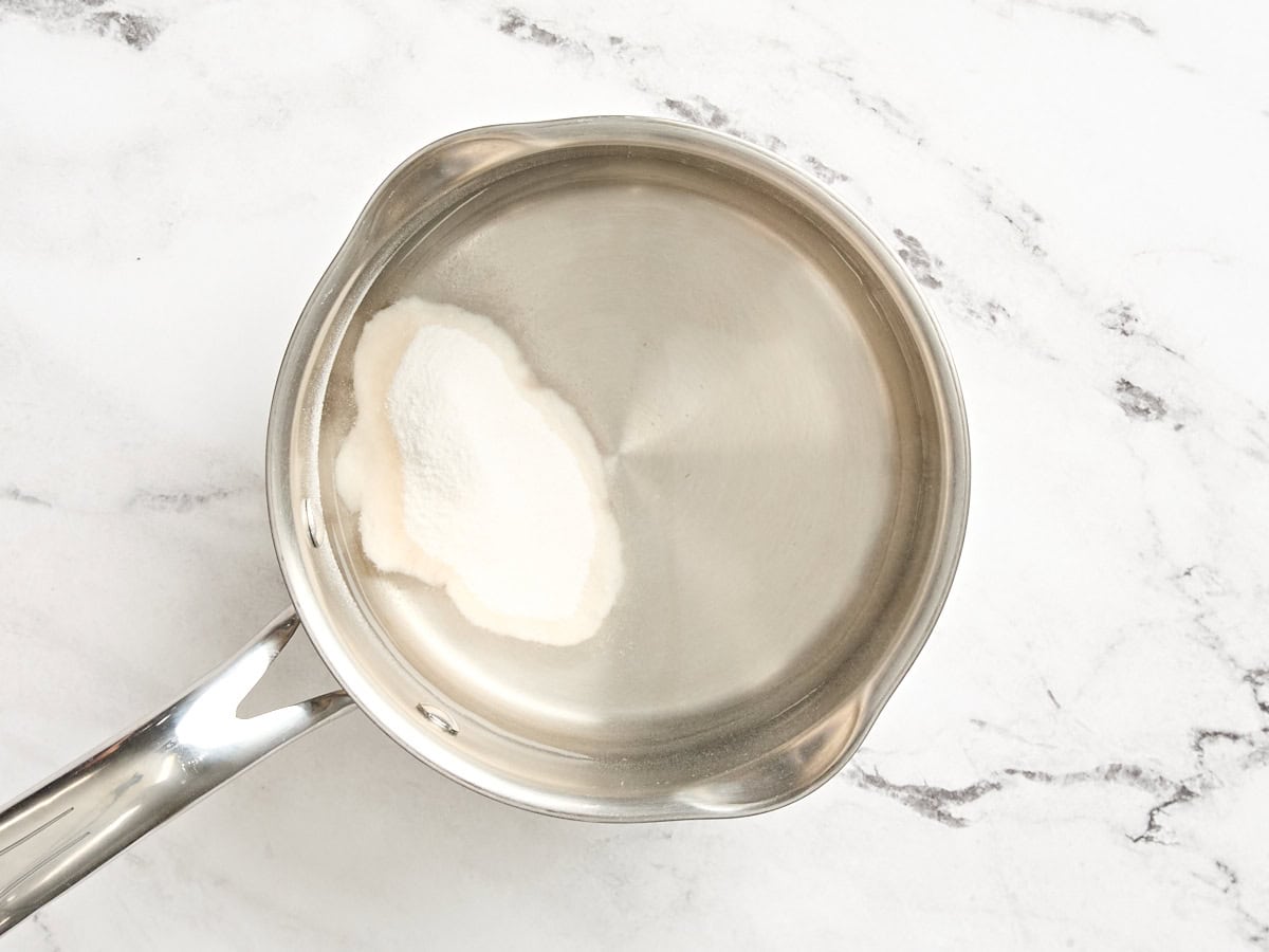 Water and fruit pectin in a sauce pan.