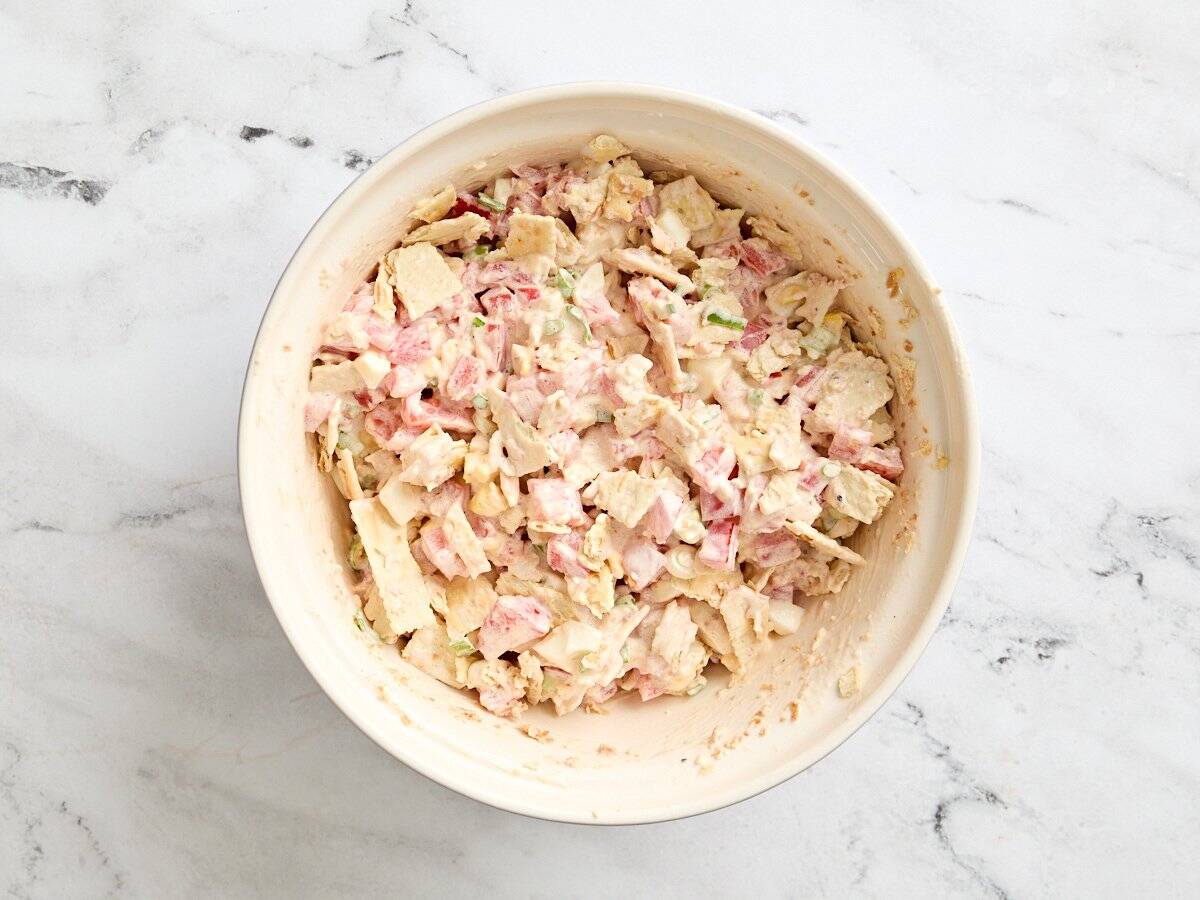 A bowl of tomato cracker salad