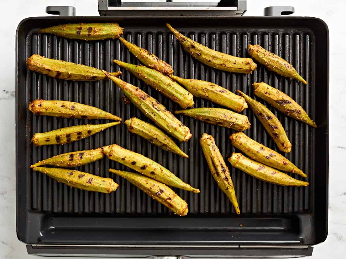 Grilled okra on a grill.