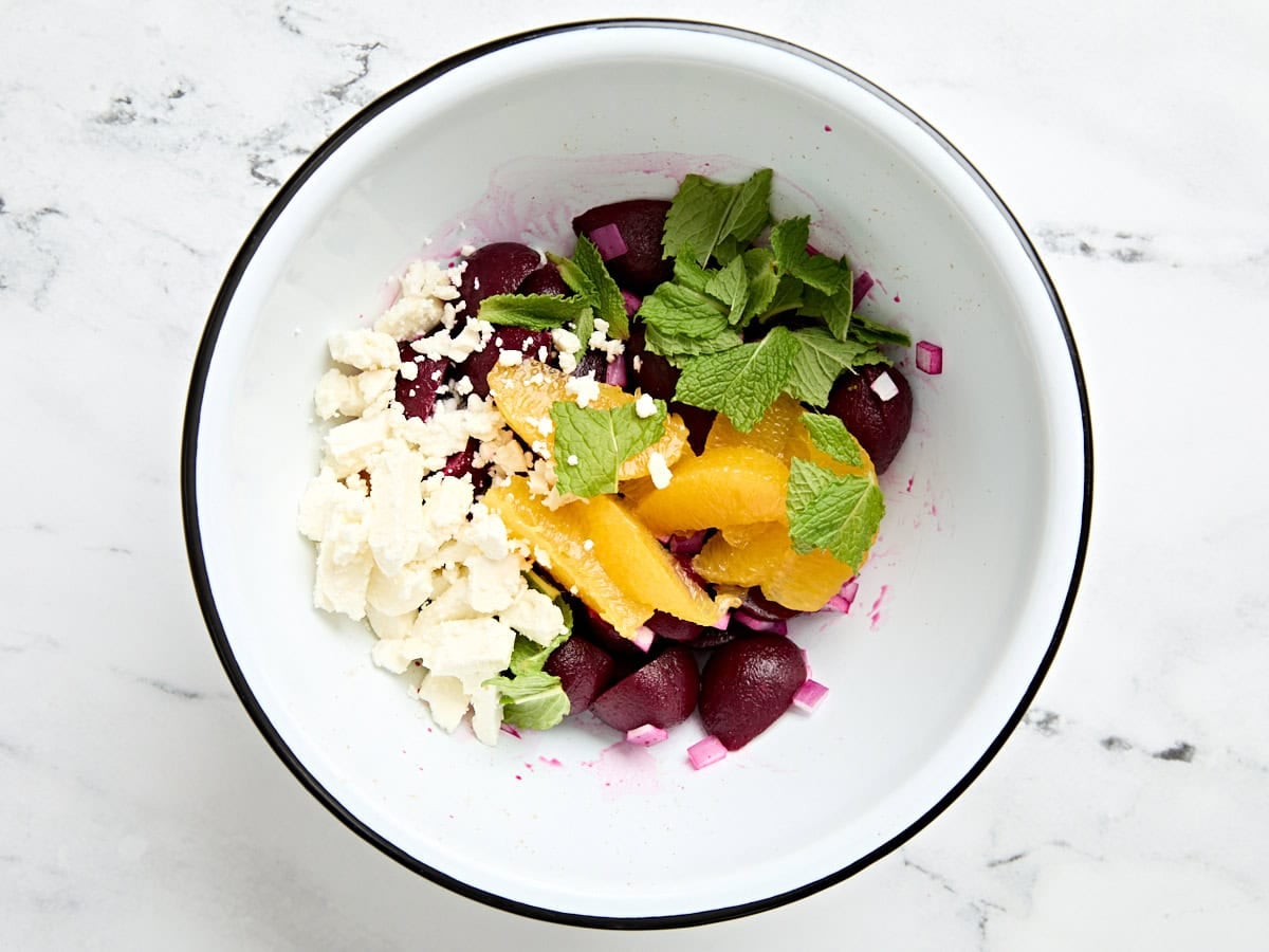 The ingredients for a beet salad in a bowl.