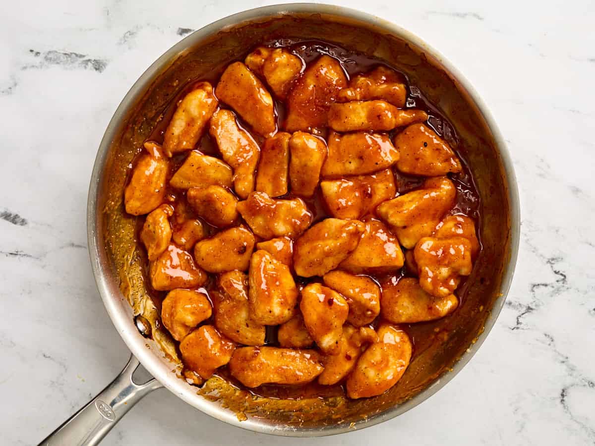Finished firecracker chicken in a skillet.