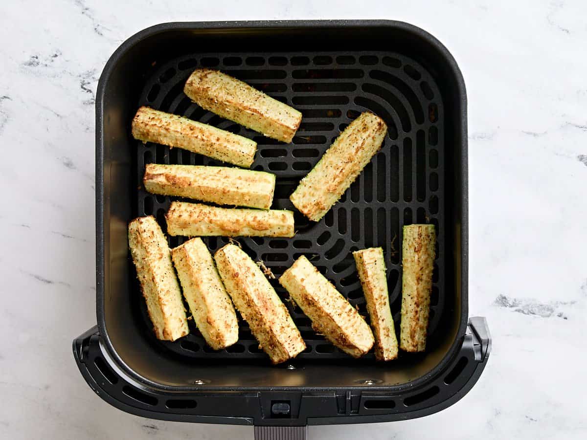 Air fried zucchini in an air fryer.