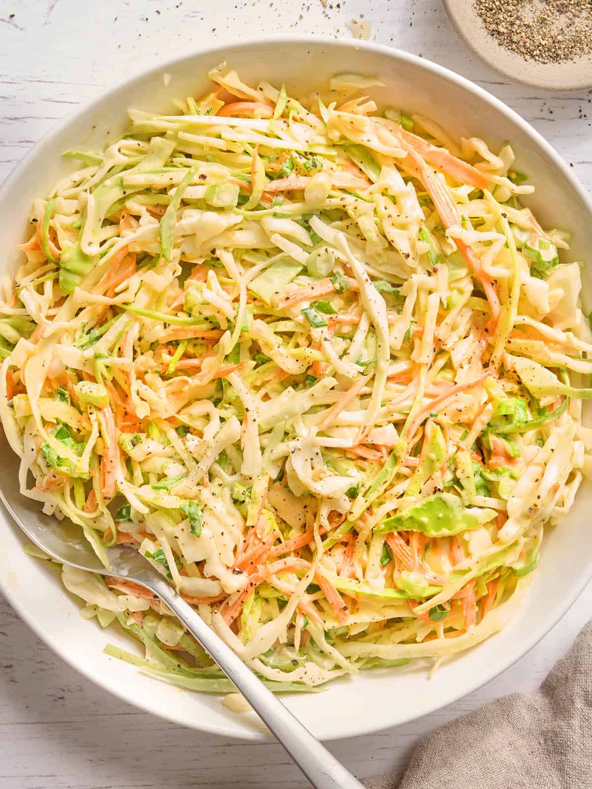 Overhead view of a bowl of creamy coleslaw.