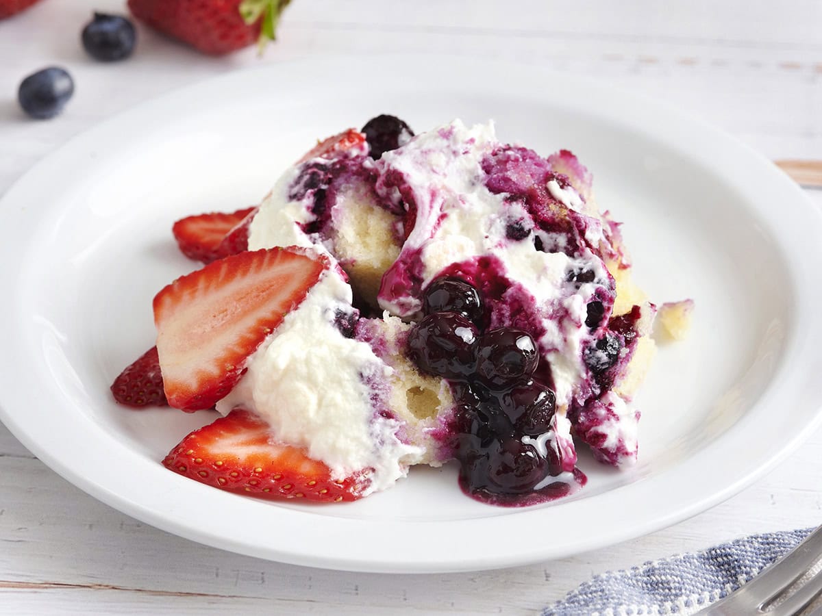 A serving of berry trifle on a plate.