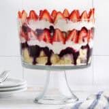 Side view of a homemade red white and blue trifle in a trifle dish.