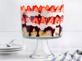 Side view of a homemade red white and blue trifle in a trifle dish.