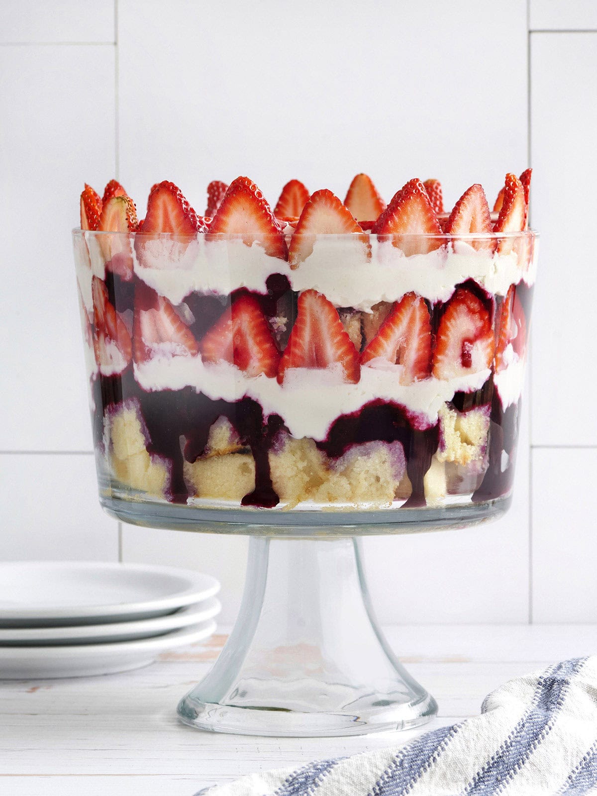 Side view of a homemade red white and blue trifle in a trifle dish.