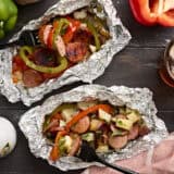 Overhead view of two foil packets with a fork taking some.