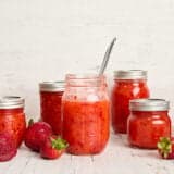 Side view of multiple jars of freezer jam.