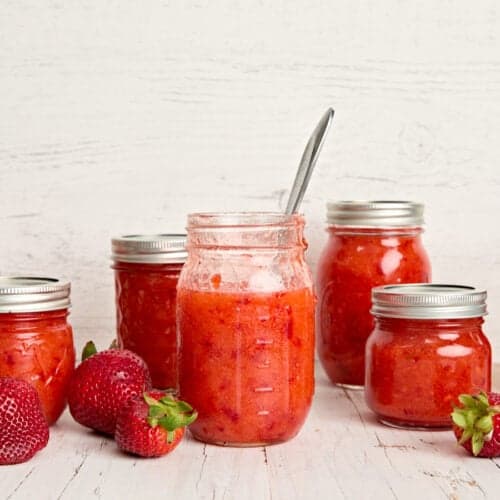 Side view of multiple jars of freezer jam.