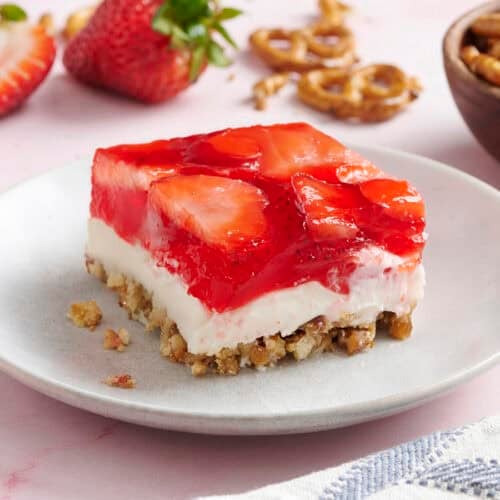 Side view of a slice of homemade strawberry pretzel salad.