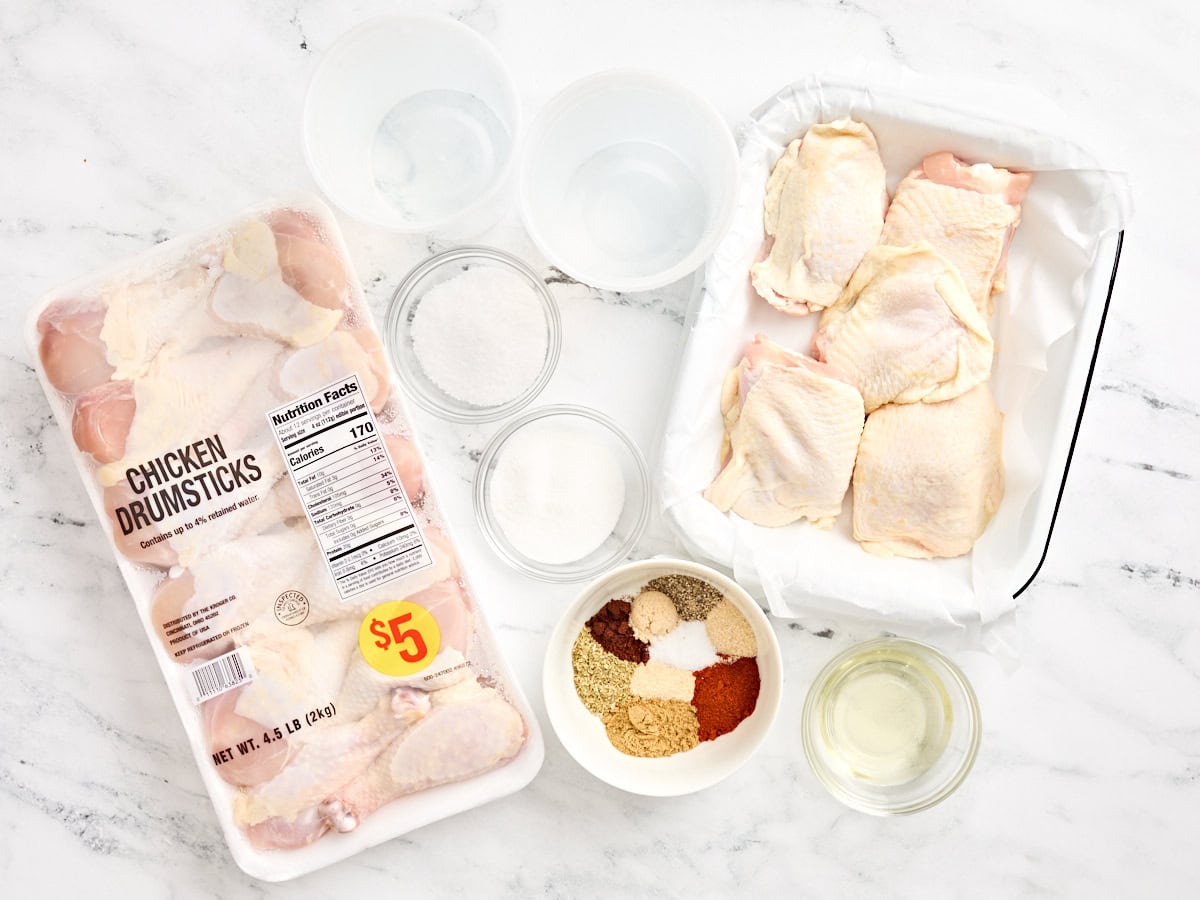 The ingredients to make dry rubbed grilled chicken drumsticks and thighs.