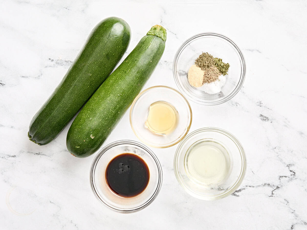 The ingredients to make grilled zucchini.