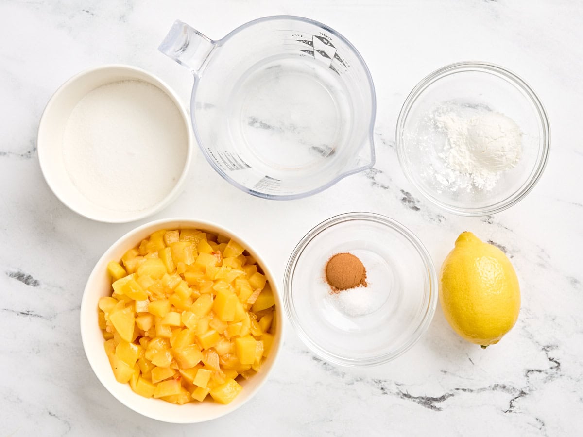The ingredients to make peach sauce.