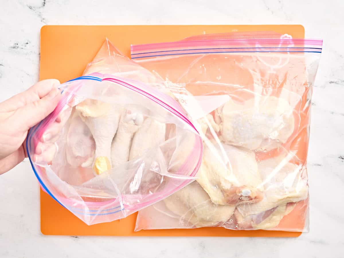 Drumsticks and thighs in a ziplock bag with a salt brine.