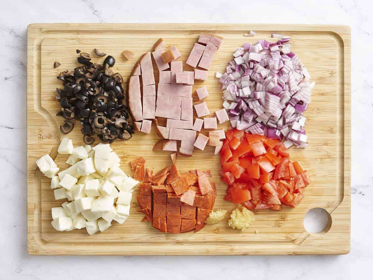 Diced ham, red onion, olives, feta, pepperoni, and tomato.