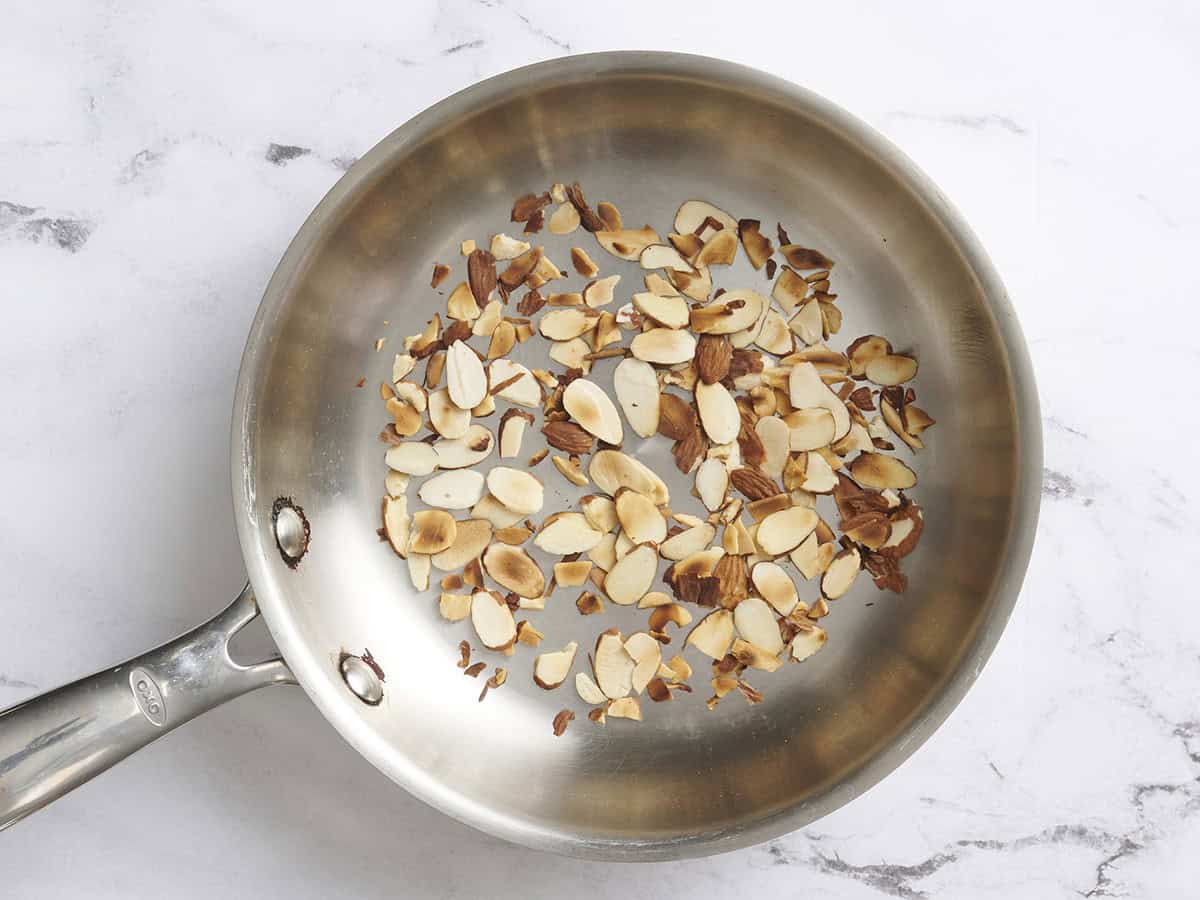 Almonds toasting in a skillet.