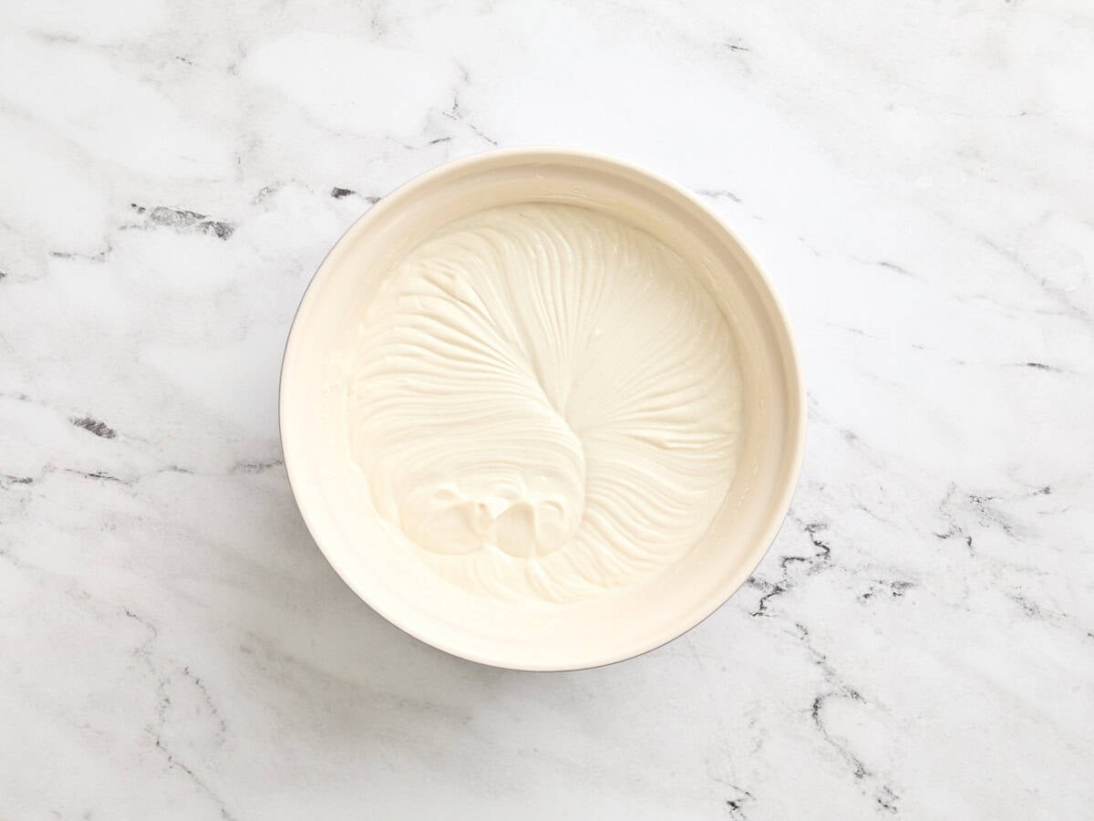 Homemade frozen yogurt mixture in a mixing bowl before freezing.