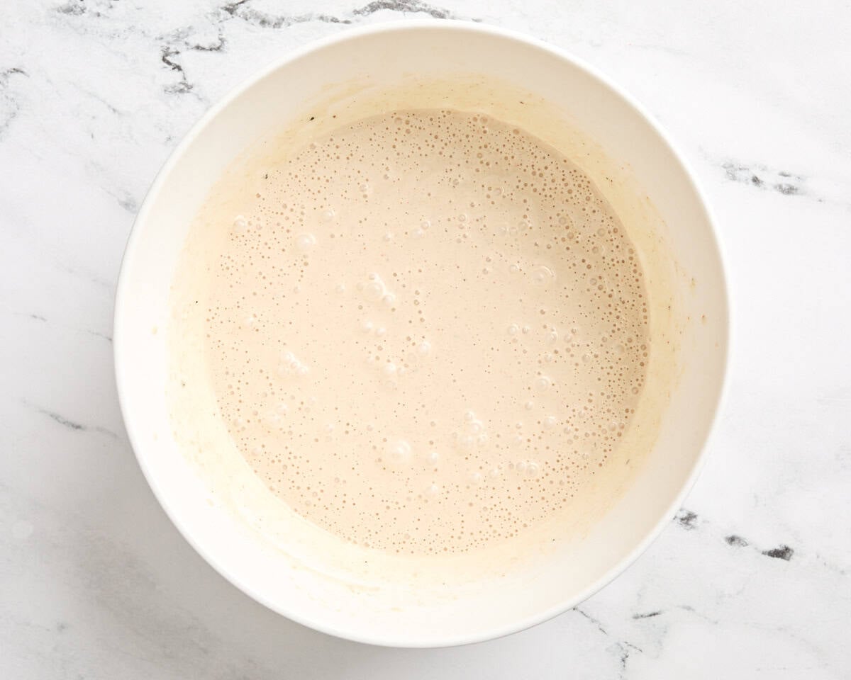Homemade alabama white sauce in a mixing bowl.