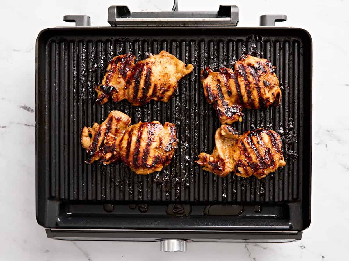 Overhead view of grilled honey lime chicken on a grill.