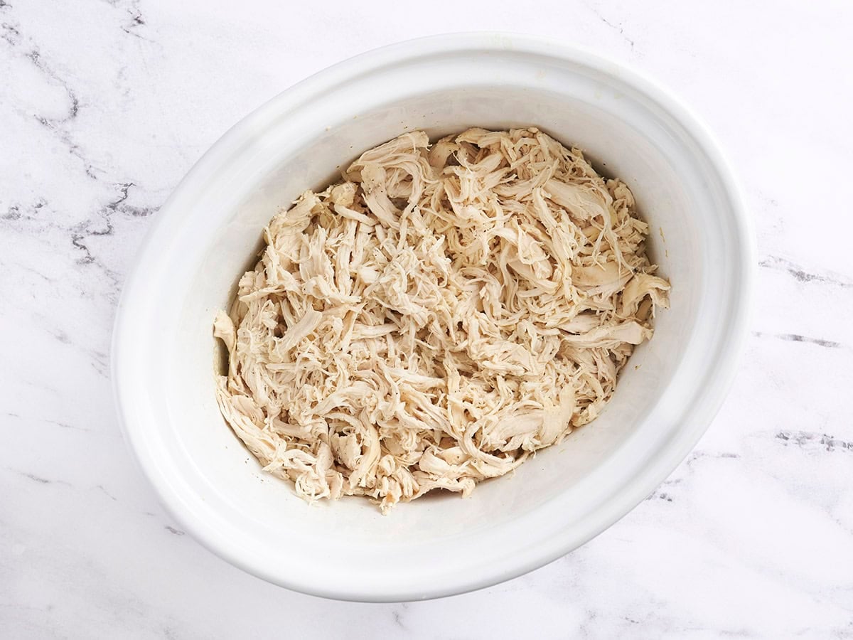 Shredded chicken in a crockpot.
