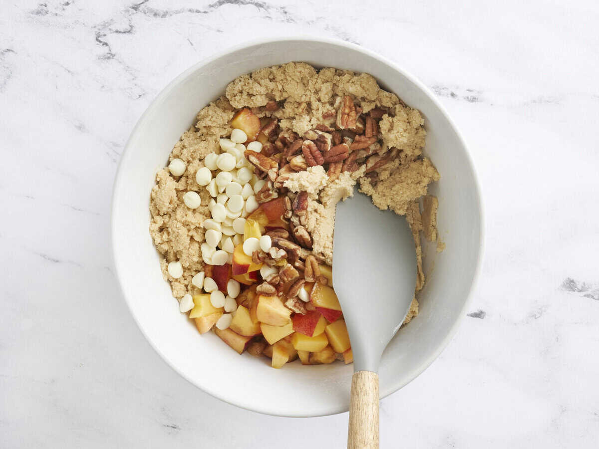 The ingredients for peach cookies in a mixing bowl.