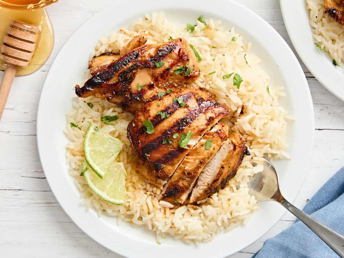 Overhead view of honey lime chicken on a plate with rice.