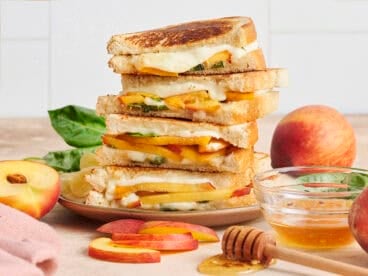 A stack of honey peach grilled cheese sandwiches.