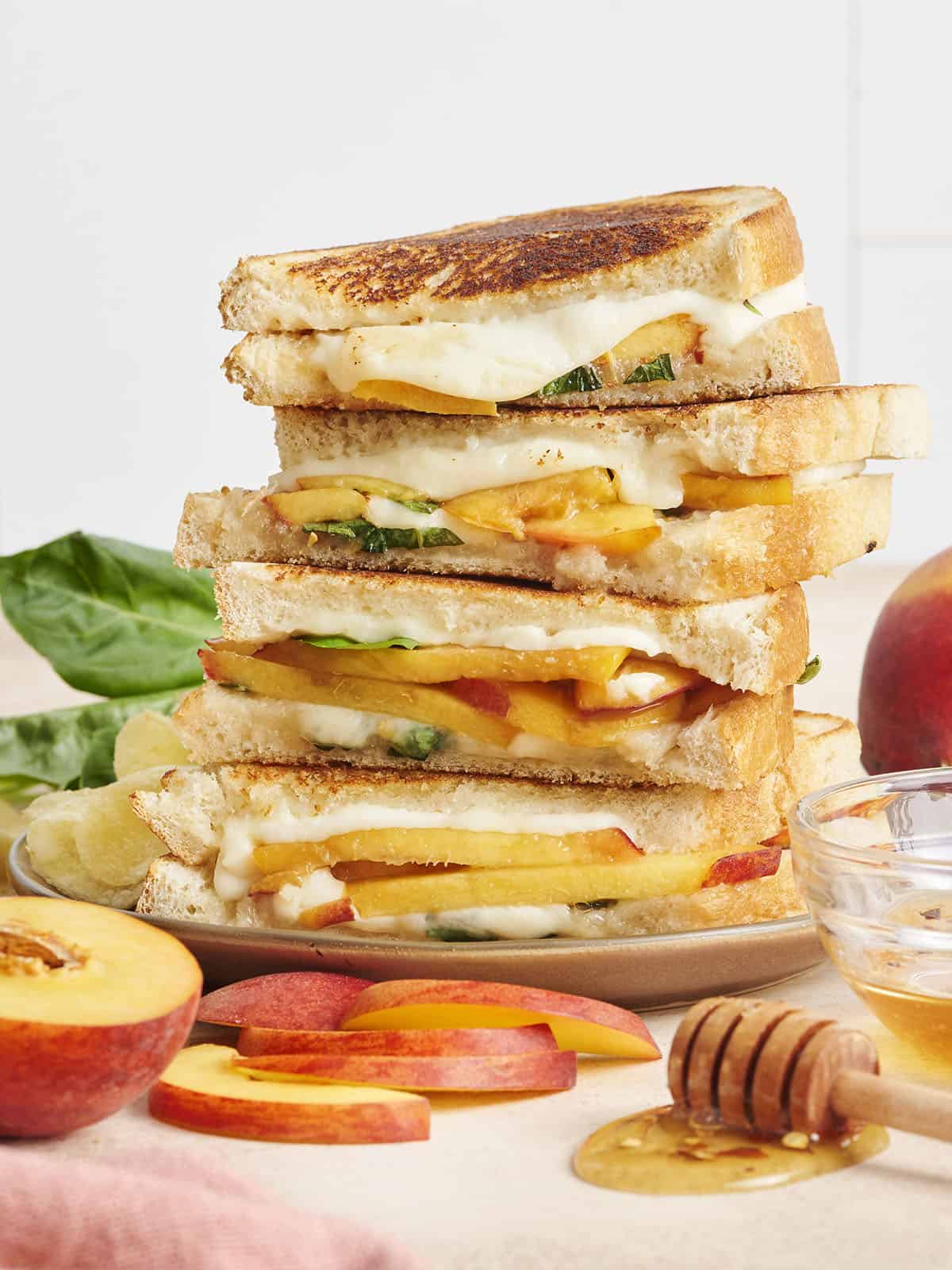 A stack of honey peach grilled cheeses.