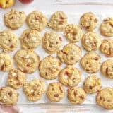 Overhead of peaches and cream cookies on a parchment lined wire rack.