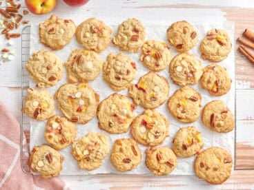 Overhead of peaches and cream cookies on a parchment lined wire rack.