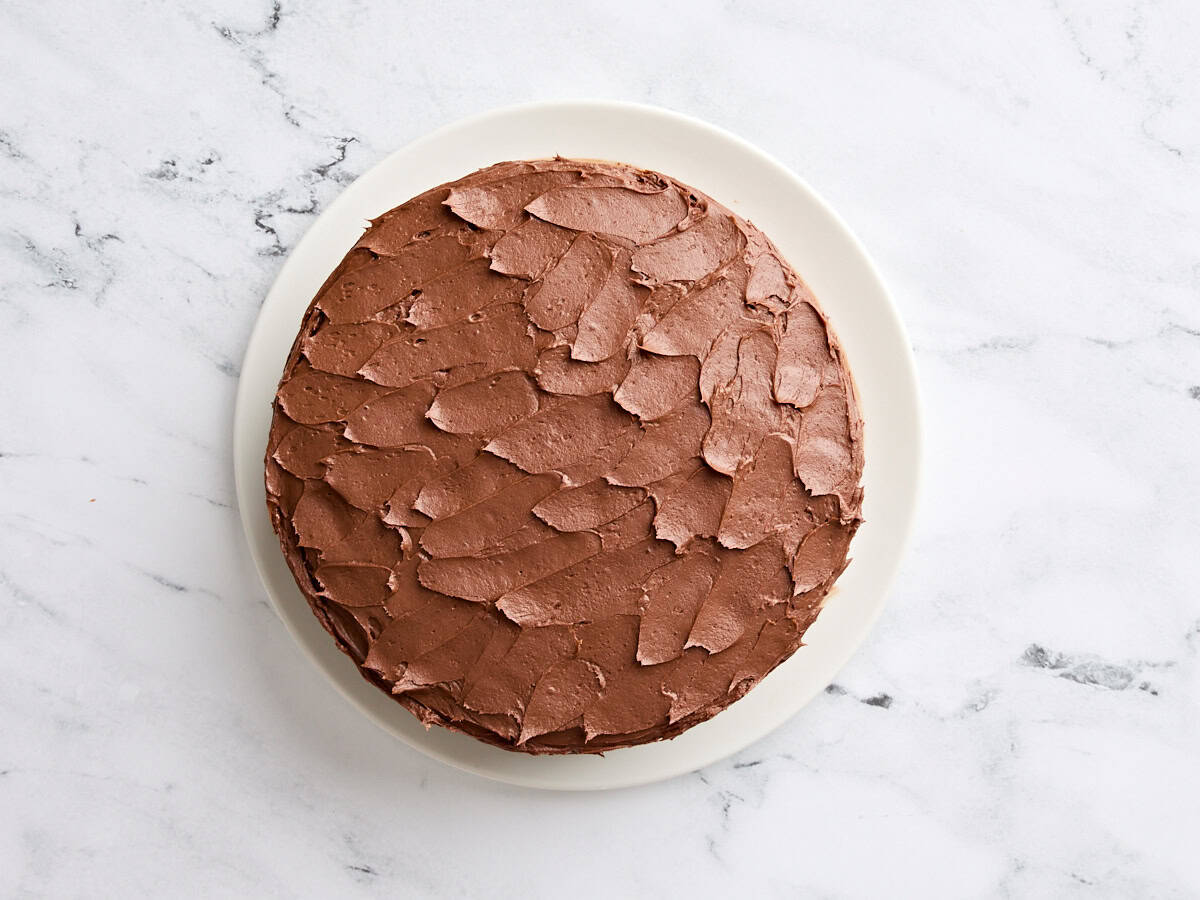 Finished classic vanilla cake with chocolate buttercream.