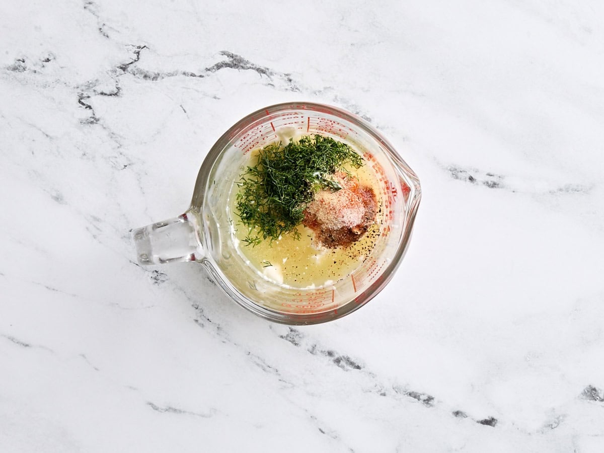 Dill pickle salad dressing ingredients in a bowl.