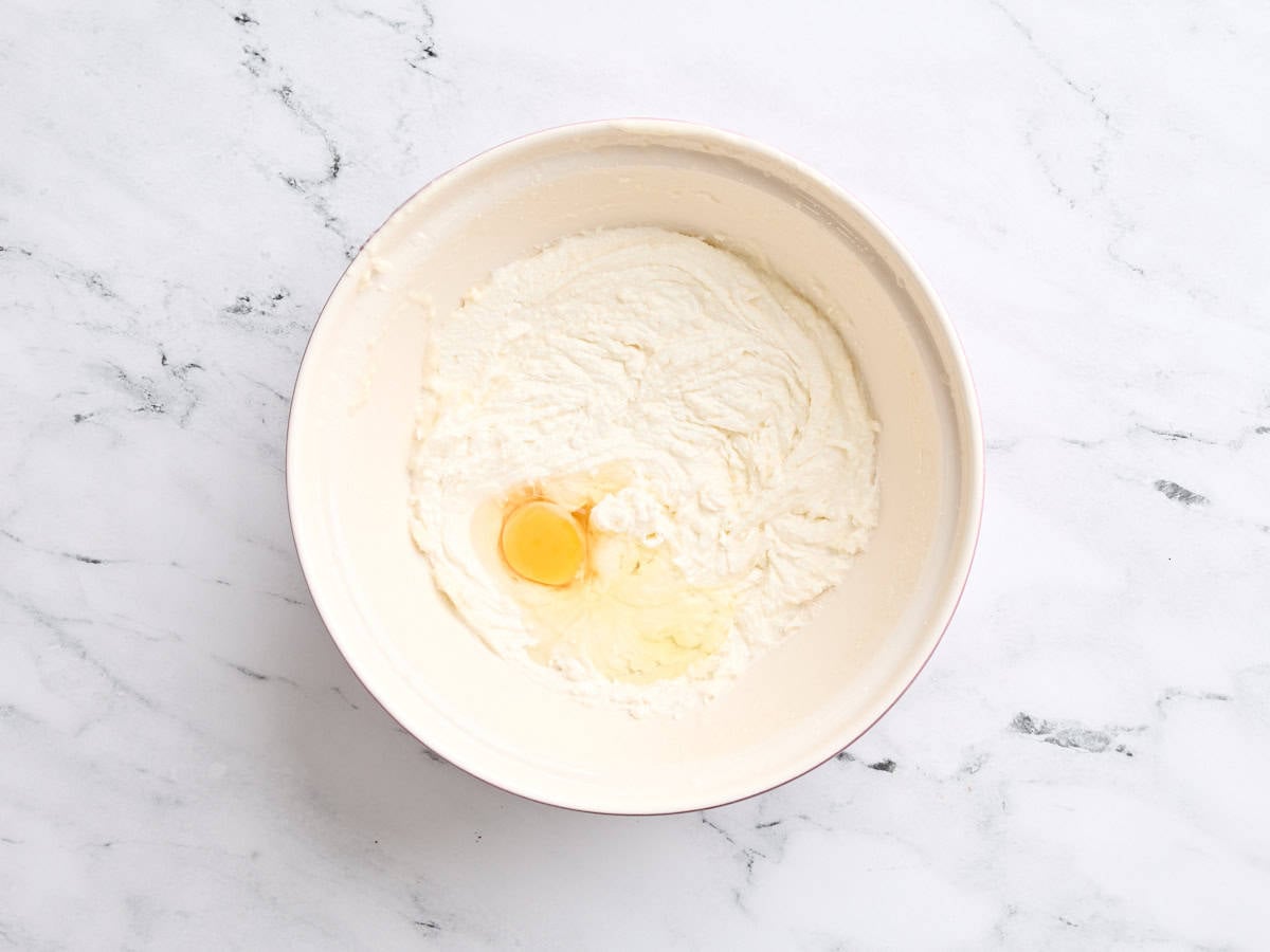 An egg added to creamed butter and sugar.