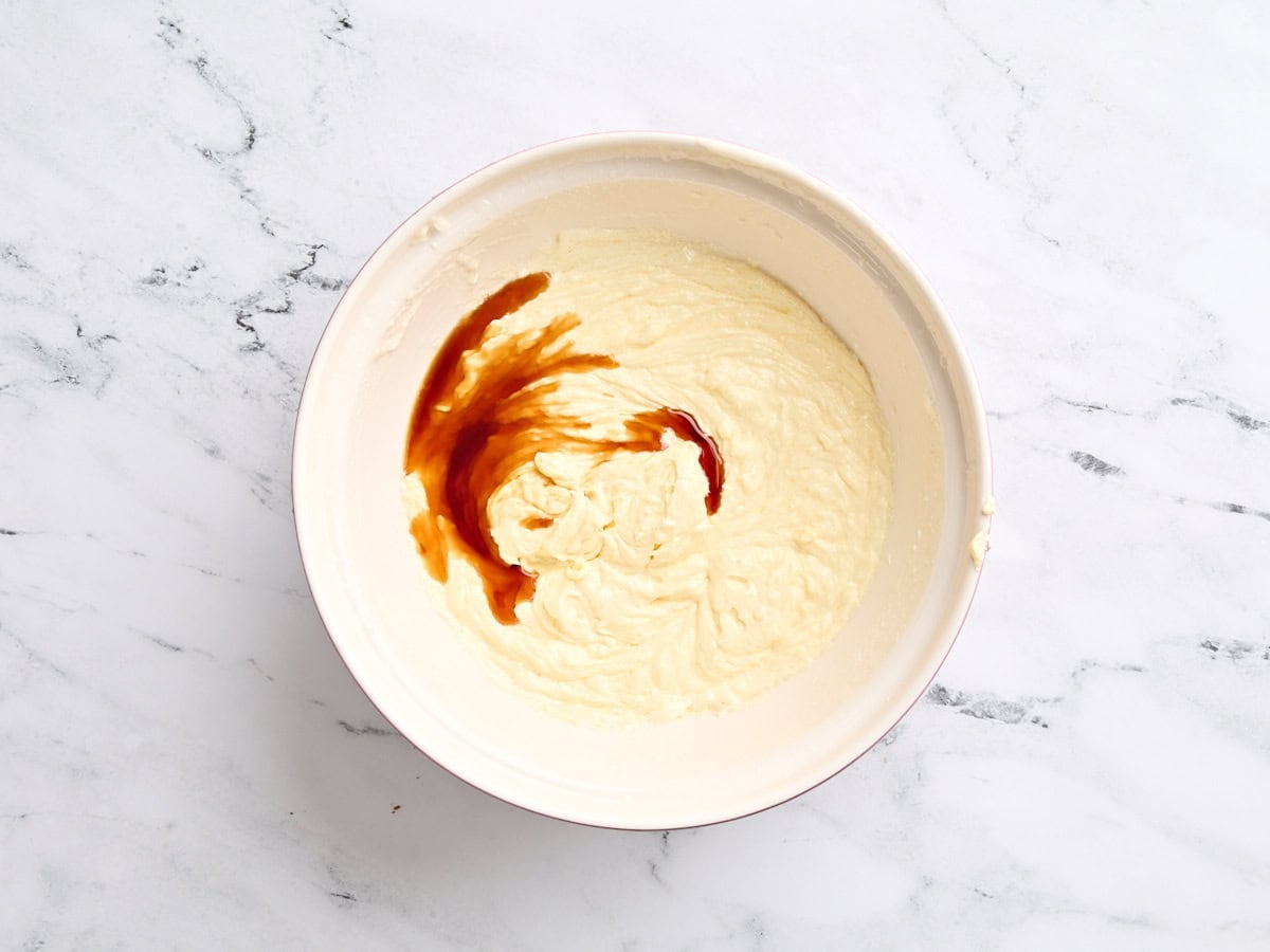 Vanilla extract added to a butter, oil, and sugar mixture.