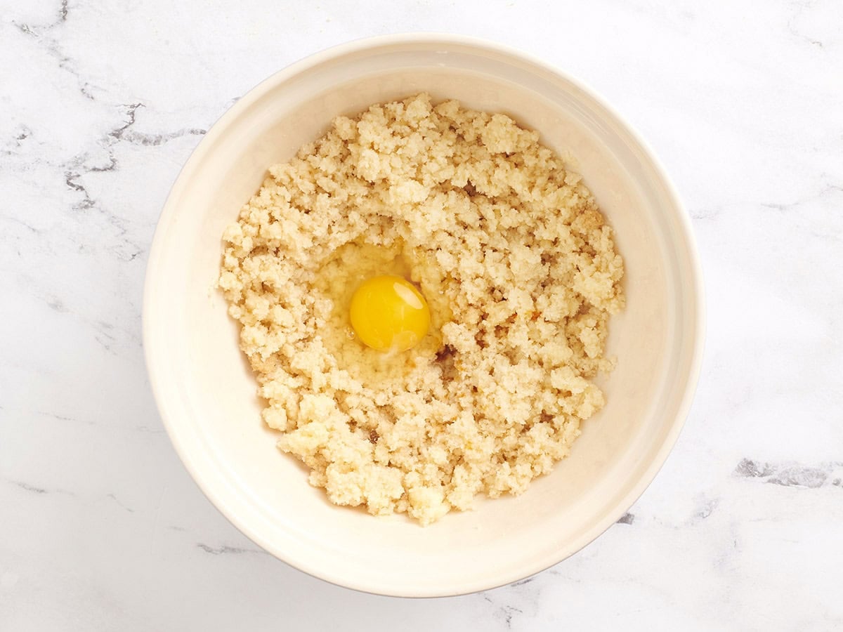 An egg added to creamed butter and sugar.