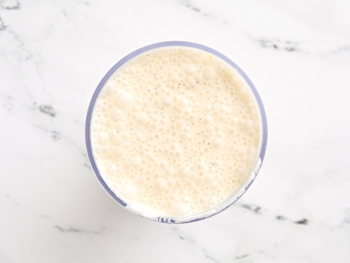 Vegetarian caesar dressing in a mixing bowl after blending.