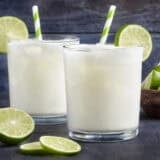 Side view of two glasses of homemade Brazilian lemonade.