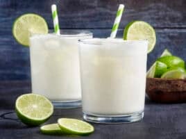 Side view of two glasses of homemade Brazilian lemonade.