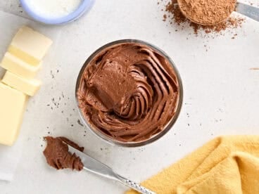 Overhead view of a pot of homemade chocolate buttercream frosting.
