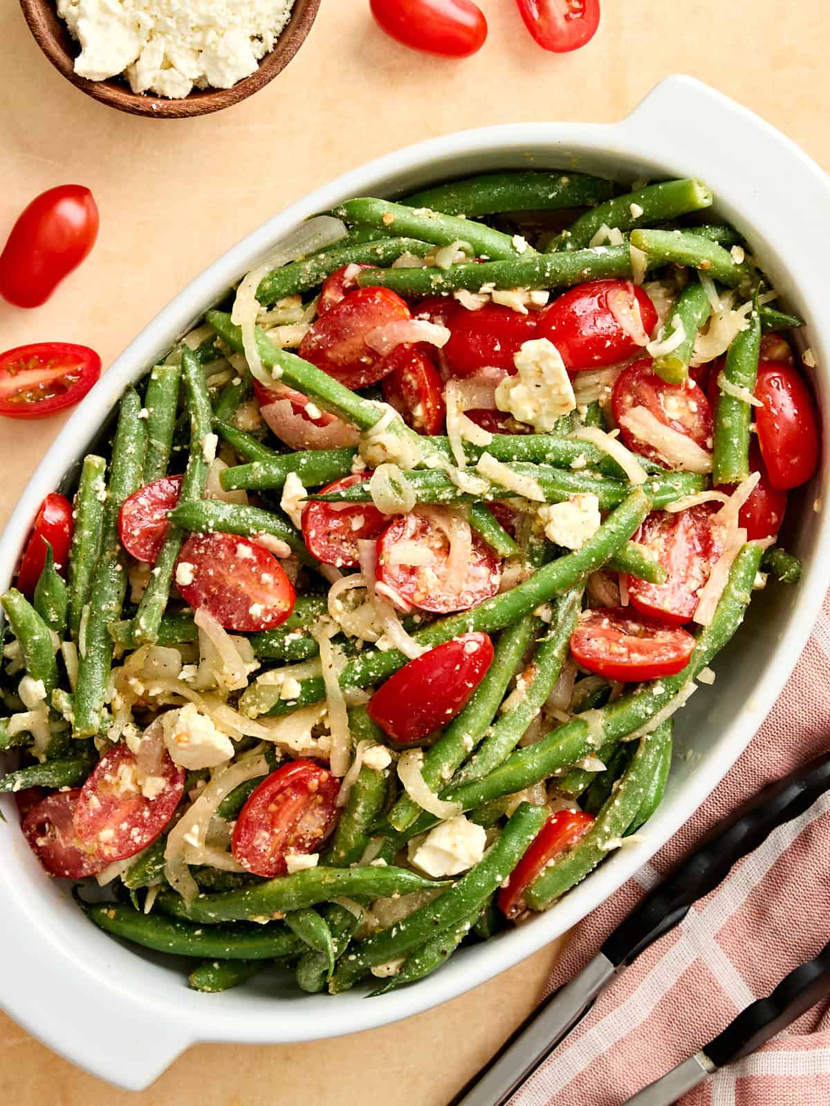 Overhead view of a green bean salad in a serving dish.