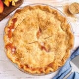 Overhead view of a homemade peach pie.