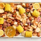 An overhead view of a shrimp boil on a sheet pan.