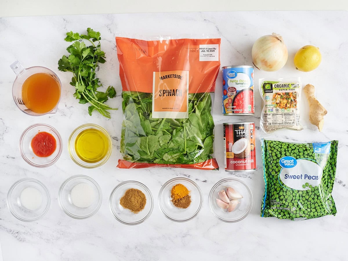 The ingredients to make a tofu, spinach and green pea curry.
