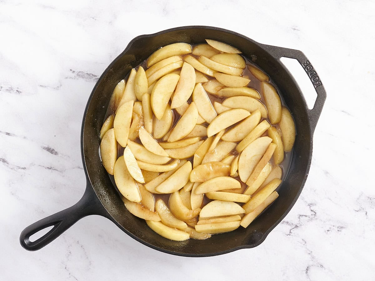 Finished fried apples in a skillet.