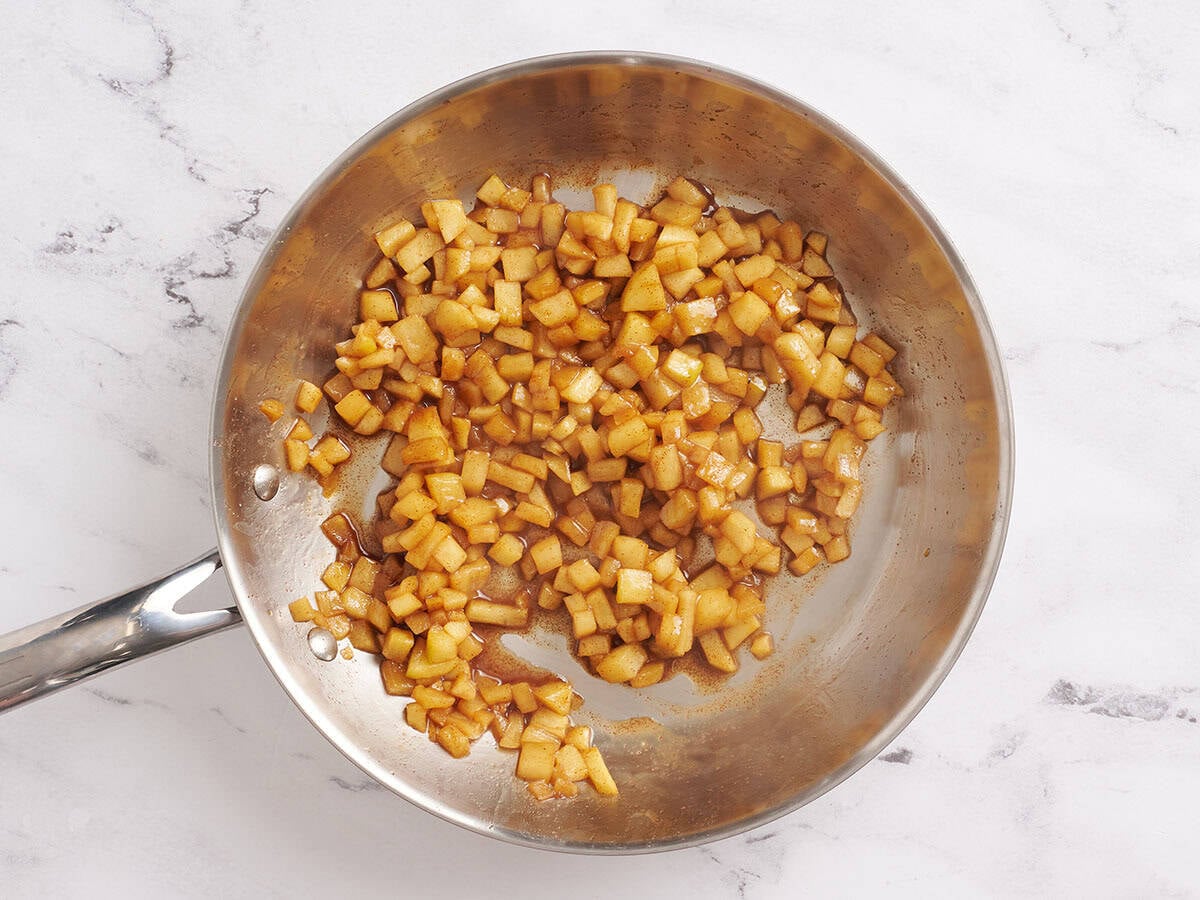 The filling for homemade apple flautas in a skillet.
