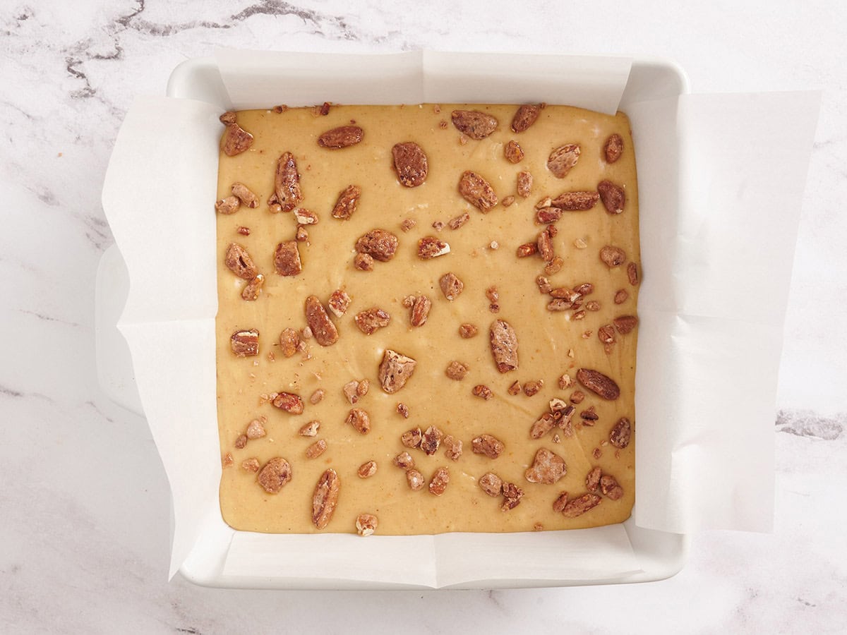 Pumpkin spice fudge batter topped with chopped candied pecans.