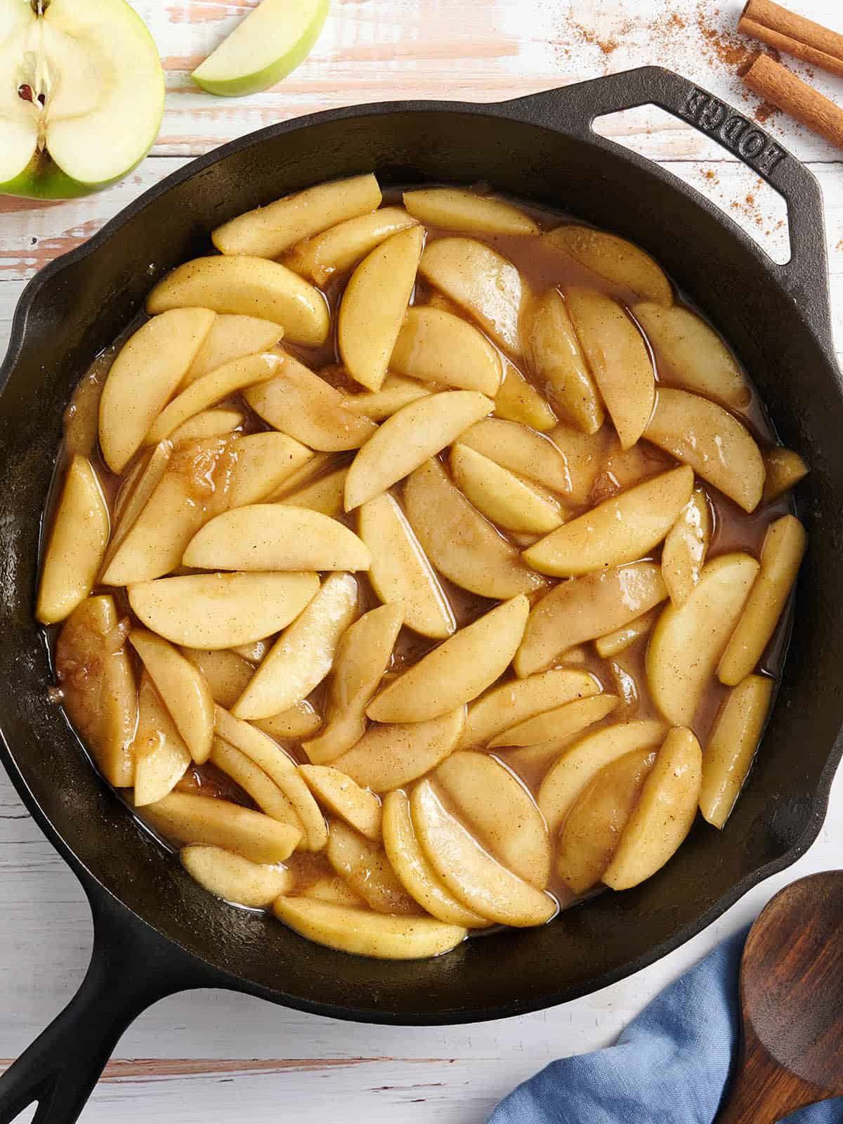 Overhead view of fried apples in a skillet.