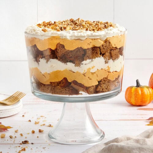 Side view of an assembled pumpkin trifle in a trifle bowl.