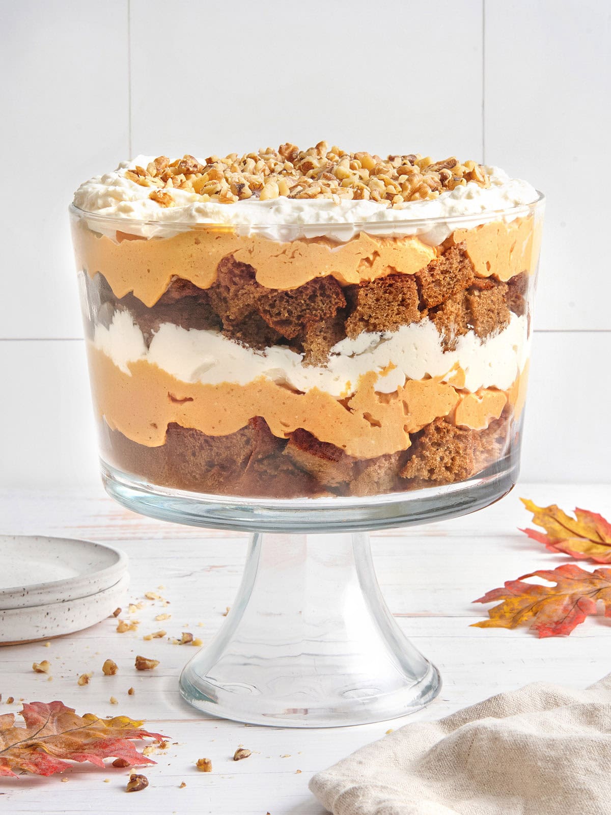 Side view of an assembled pumpkin trifle in a trifle bowl.